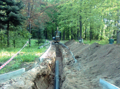 Geothermal pipeline routed through a forest