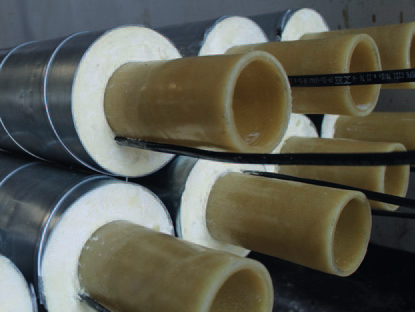Cutaway of thermoplastic carrier pipes in PUR foam