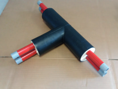 Leak detection conductors in a pre-insulated tee